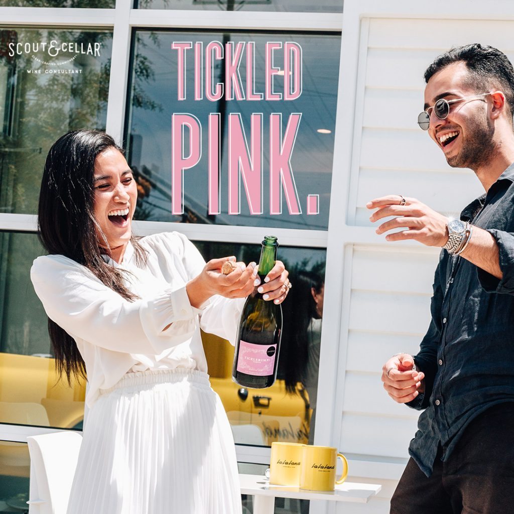 Photo of a woman and man drinking champagne.