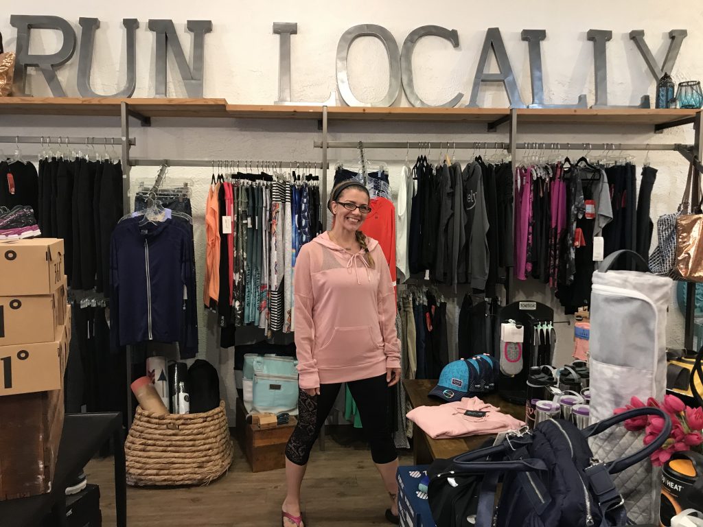 Woman standing in athletic wear shop