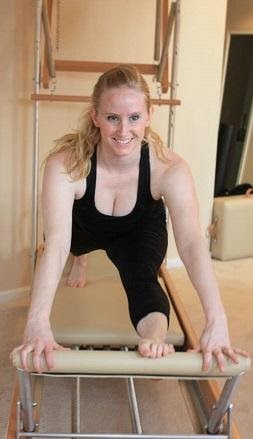 Jamie Loger on a Pilates Reformer