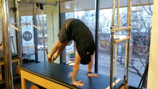 Man on Pilates apparatus 